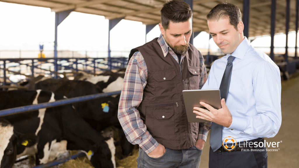 Farmer and financial adviser looking at tablet